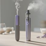 Close-up of an anxiety pen and a modern vape device on a light-wood surface with subtle vapor and out-of-focus lavender in the background.